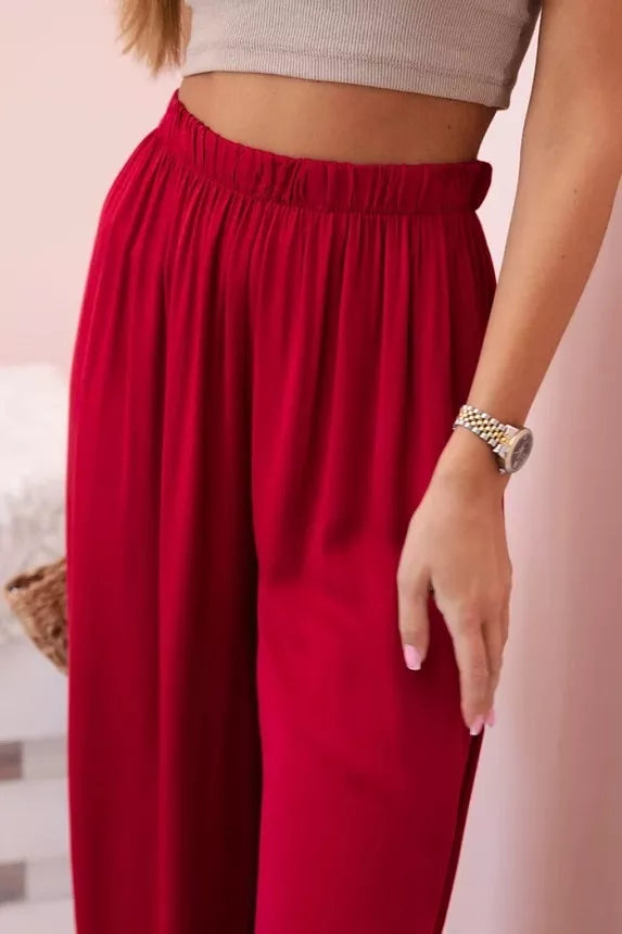 Moteriškos plačios tamsiai raudinos spalvos kelnės Andi