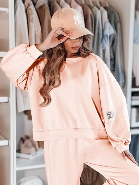 Moteriškas rožinis sportinis kostiumas Dresis